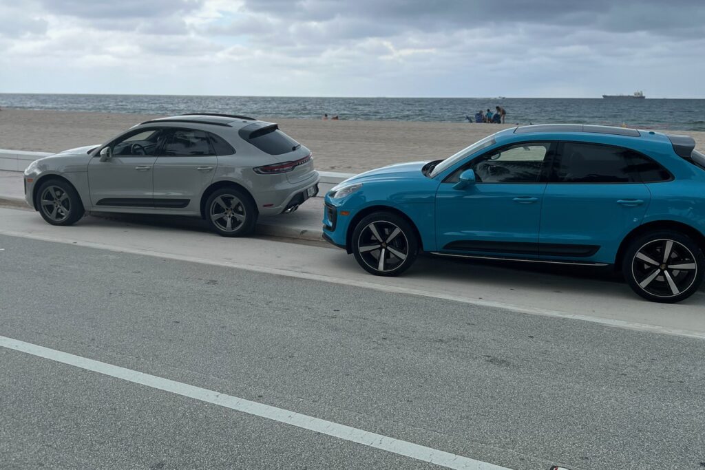 Chalk and Miami Blue Porsche Macan rentals at the Fort Lauderdale beach — Turtur Luxury Cars