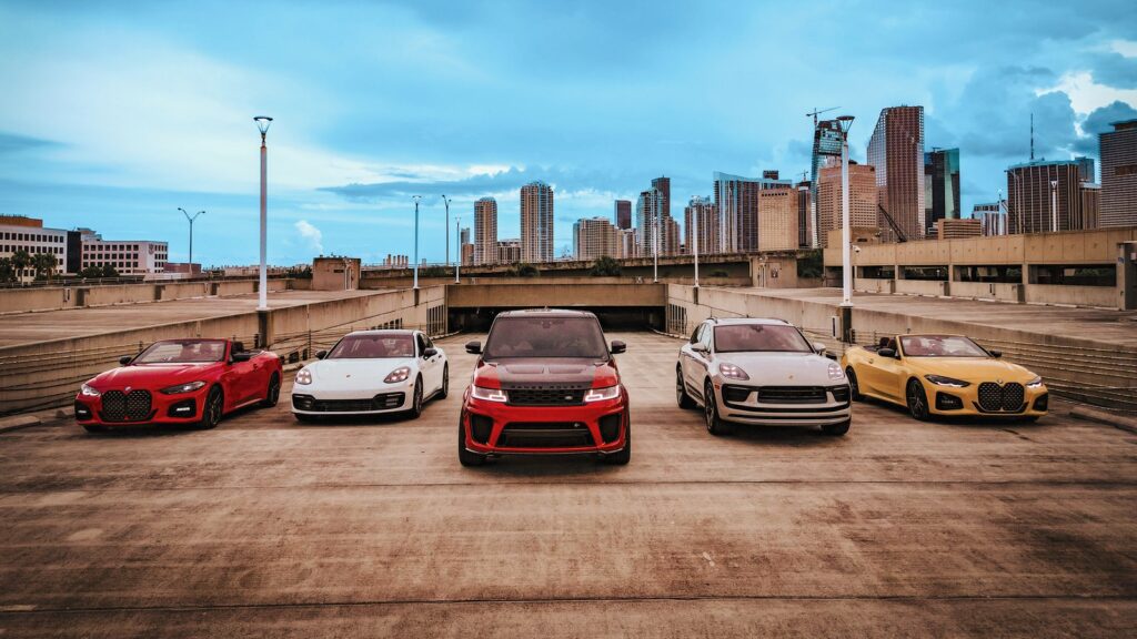 Turtur Luxury Cars boutique fleet — BMW, Porsche, Range Rover, BMW M4 Convertible — minutes from FLL Airport